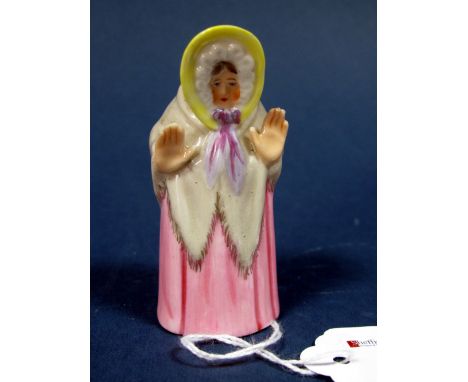 A Royal Worcester Porcelain Candle Snuffer, 'Granny Snow', wearing a yellow bonnet, grey shawl and pink dress, date code for 