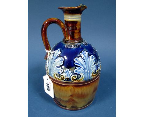 A Doulton Lambeth Stoneware Pottery Advertising Flask for 'Grant Mackay & Co. Scotch Whisky', the dark blue and brown grounds