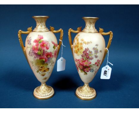 A Pair of Royal Worcester Porcelain Vases, of two handled, footed ovoid form, the blush ivory grounds printed and painted wit