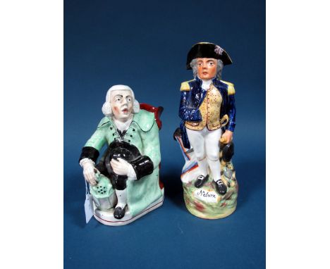 A Late XIX Century Pottery Toby Jug, modelled as Nelson in Naval uniform, standing upon a titled rocky circular base, 29cms h