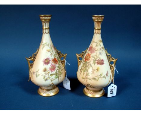 A Pair of Royal Worcester Porcelain Vases, of two handled pear shape, the blush ivory grounds printed and painted with chrysa