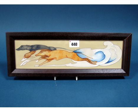 A Modern Moorcroft Rectangular Pottery Plaque, painted in the Wind Runner pattern on a light green ground, designed by Emma B