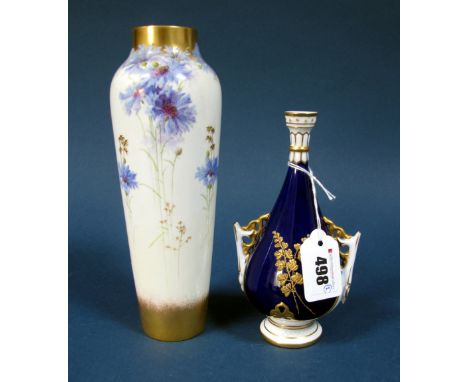 A Royal Worcester Porcelain Vase, of twin handled pear shaped form, with moulded circular base and neck, decorated in gilt wi