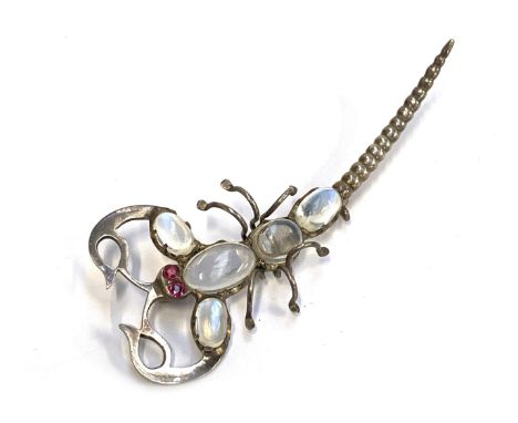 An early 20th century white metal scorpion brooch set with moonstones and ruby eyes, 7cmL, 8.6g
