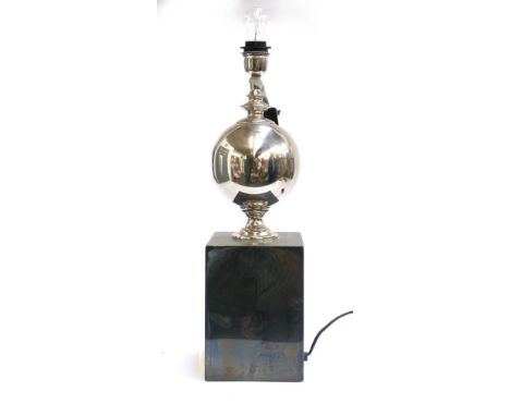 An Eichholtz table lamp, chromed orb on a pattinated square base, 59cmH