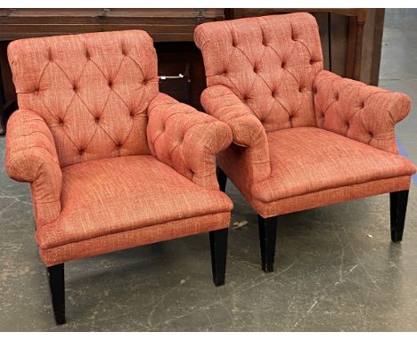 A pair of modern button upholstered armchairs, on black painted square tapered legs, 82cmW