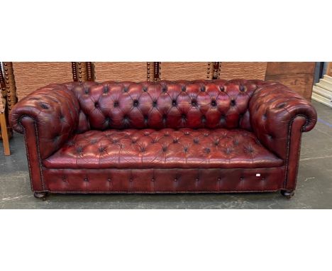 An oxblood leather button upholstered chesterfield sofa, 200cmW