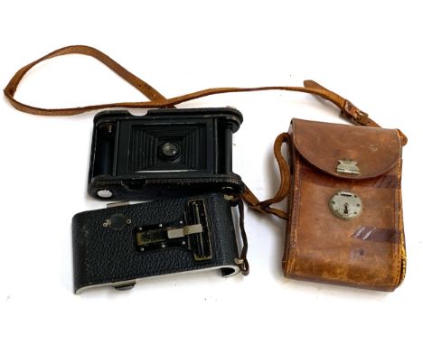A vintage Kodak bellows camera, with leather case