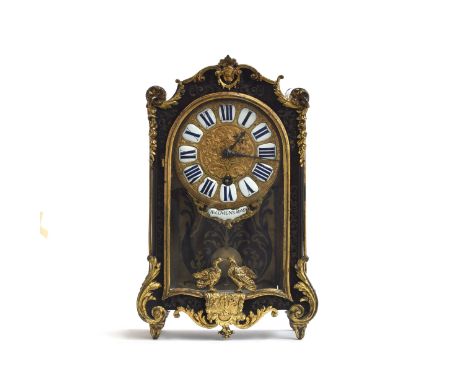 A Louis XV ormolu mounted and boulle mantel clock by Decovigny, mid 18th century, brass embossed dial depicting swags and scr