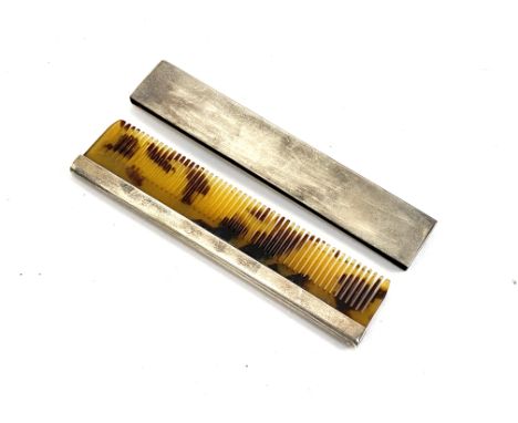 A small silver cased comb, 9cmL, hallmarked Birmingham, Adie Brothers, 1937 and 1938, 18g