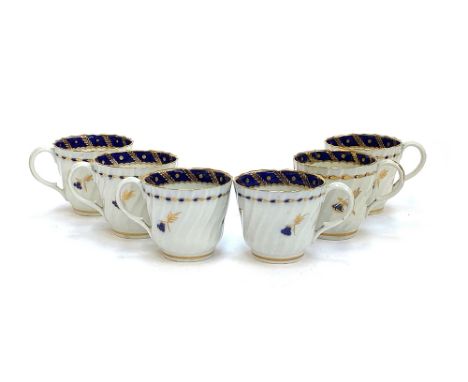 A set of six Worcester coffee cups, with cobalt blue and gilt rims, crescent mark to base, some damage