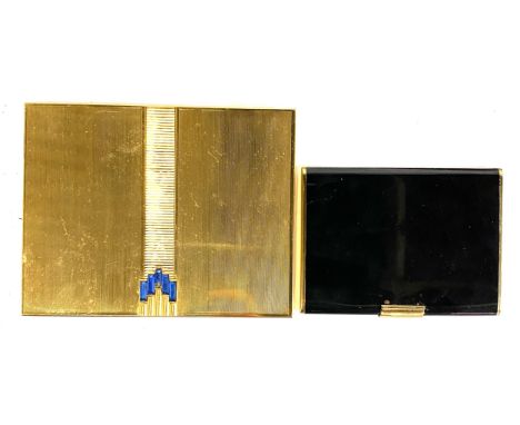 A Volupte gilt metal compact c.1950, set with blue baguette cut paste, 15.5cmW; together with a further black vintage compact