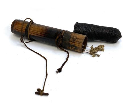A bamboo quiver containing a quantity of blow darts, with wicker top, overall 43cmL