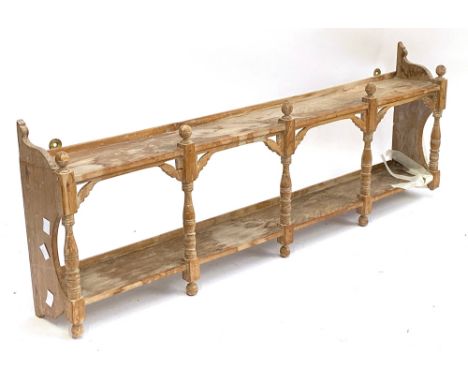 A wall shelf with turned spindles, 94cmL