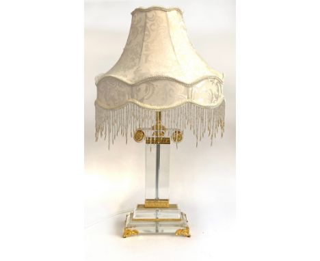 A lucite and gilt metal table lamp in the form of a column, with beaded shade, 70cmH overall