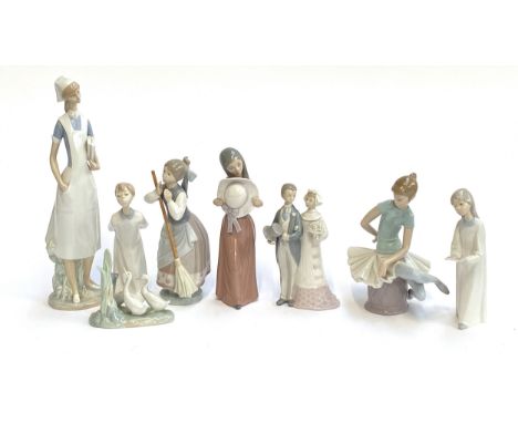Seven various Lladro figures, the largest 36cm high; together with a Nao figurine of three geese (8)
