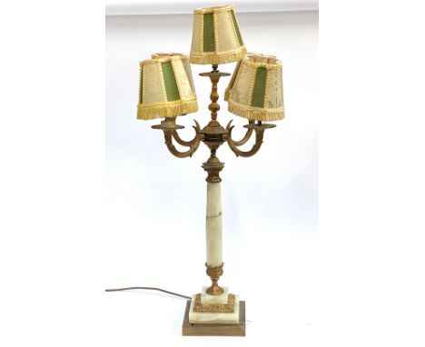 A gilt metal and onyx five fitting table lamp, with clip on shades, on a square stepped base, 82cm high overall