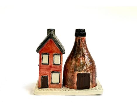 A Poole pottery tealight holder, 12cmH