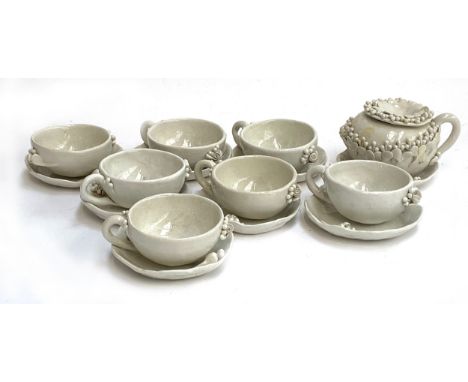 Delores Demurtas (Sardinian, 1935-2023), a set of eight white majolica teacups and saucers, teapot and sugar bowl, stamped to