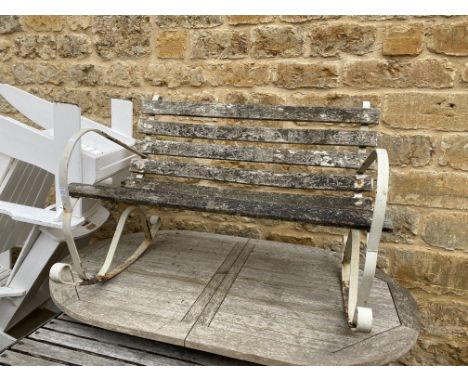 A white painted wrought metal rocking garden bench, wooden slats, 112cmW