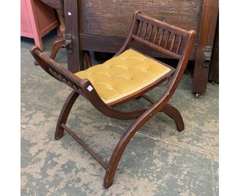 A campaign folding cross frame stool, button upholstered