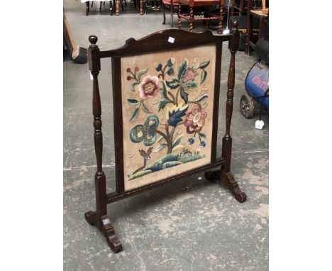 A Victorian crewelwork firescreen, 73cmH