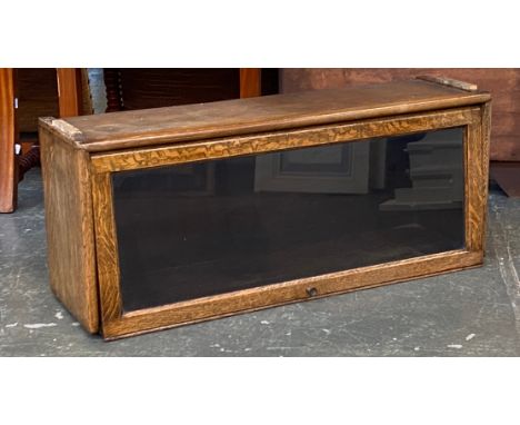 A single section from a globe wernicke style oak glazed sectional bookcase, 87x25x36cmH