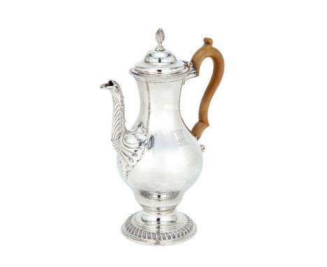 A George III silver baluster coffee pot by Charles Wright, London 1771, with a wrythen finial to the ogee domed cover, a gadr