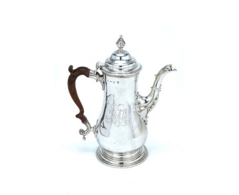 An early George III silver baluster coffee pot by Benjamin Bickerton, London 1763, with a beaded conical finial to the ogee d