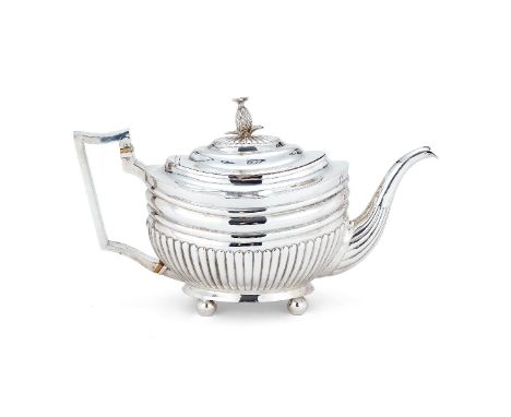 ϒA George III silver oval tea pot by Solomon Hougham, London 11th October 1804-28th May 1805, with a pineapple finial to the 