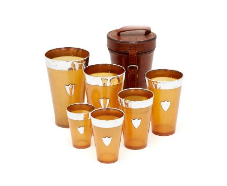 A set of six graduated Scottish silver collared horn beakers by William Dunningham & Co., Edinburgh 1934, the collars plain, 