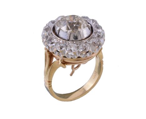 A late Victorian diamond cluster ring, circa 1890, the central old mine cut diamond weighing 2.57 carats, within a surround o