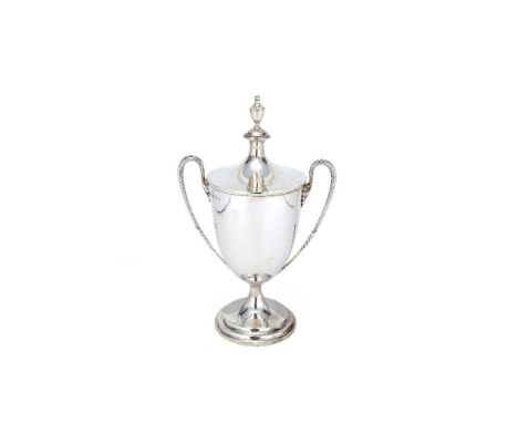 A silver twin handled trophy cup and cover by Garrard & Co. Ltd (Sebastian Garrard), London 1937, in George III style, with a