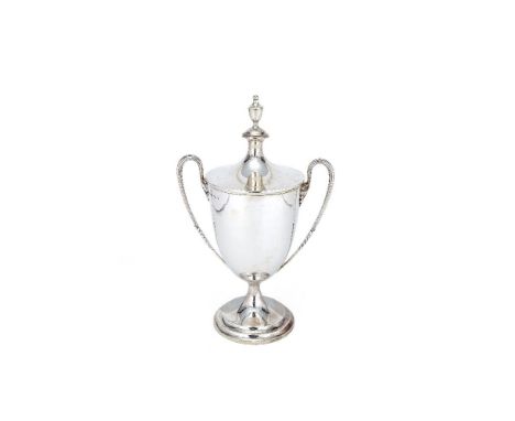 A silver twin handled trophy cup and cover by Garrard & Co. Ltd (Sebastian Garrard), London 1937, in George III style, with a