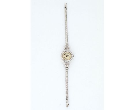 A lady's diamond cocktail watch, manual wind movement, cream dial, Arabic numerals, blued steel hands, old brilliant cut diam