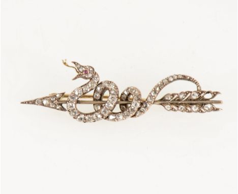 An arrow and coiled snake design brooch set with rose cut diamonds (one missing), 50mm long.