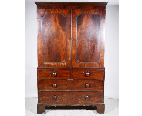 Early Victorian mahogany linen press, key pattern cornice, two panelled doors to the upper section, two short and two long dr