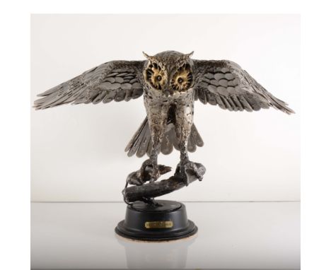 Sandy A. M. O'Connor, a contemporary welded steel sculpture of a barn owl with mouse, mounted on a cylindrical metal plinth w