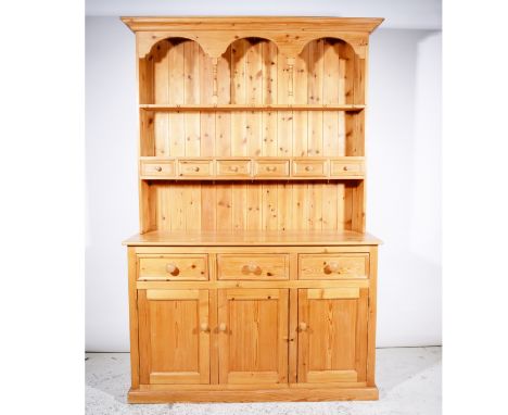 Modern pine dresser, two-shelf delft rack incorporating six spice drawers, base with three drawers over three panelled doors,