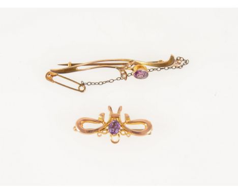 Two amethyst brooches, a 55mm bar brooch set with an amethyst and four seed pearls, a 30mm brooch with single amethyst and ho