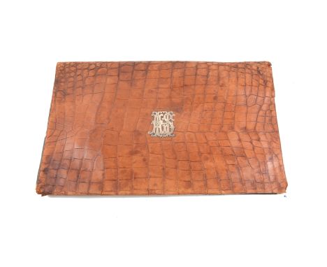 An early 20th Century desk top stationery folder with crocodile cover produced in Vienna having a silver coloured monogram "A