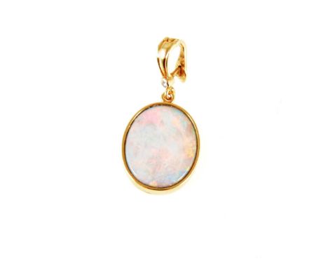 An oval cabochon cut opal doublet pendant, the stone 20mm x 16mm set in a yellow metal frame, the pendant bale marked 750 set