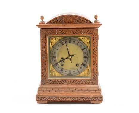 German oak case mantel clock, square brass dial with silvered chapter ring, movement striking on two gongs, 34cm.