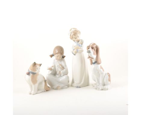 Two Lladro models of cats, 15cm and 10cm; ten Nao models, and three other Spanish models. (15)