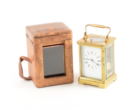 French brass cased carriage clock, rectangular enamelled dial with Roman numerals, repeating movement striking on a gong, 14c