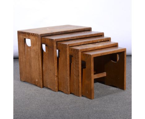 A nest of five elm tables by Ercol, in production 1964-1970 , model 495, with recessed handles to the sides, applied labels, 