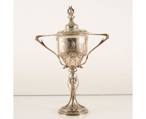 A silver Art Nouveau style croquet trophy and cover, Mappin &amp; Webb, Sheffield, 1929, the cover finial cast with three cro