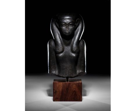 An Egyptian Basalt Portrait Bust of a WomanMiddle Kingdom, 13th Dynasty, 1773-1650 B.C.Height 10 1/4 inches.Provenance:Robert