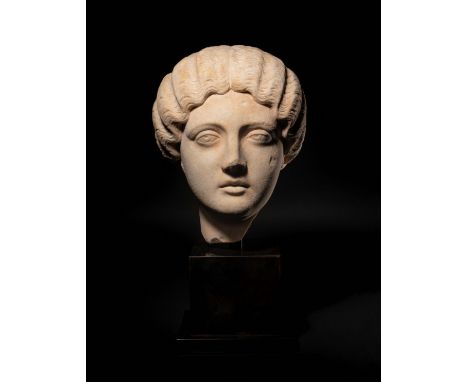 A Roman Marble Portrait Head of the Empress Faustina MinorCirca 162-176 A.D.Height of marble 12 inches.Note:Annia Galeria Fau
