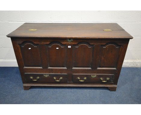 A GEORGIAN OAK MULE CHEST, four fielded panels above two drawers with brass escutcheons and drop handles, on bracket feet, wi
